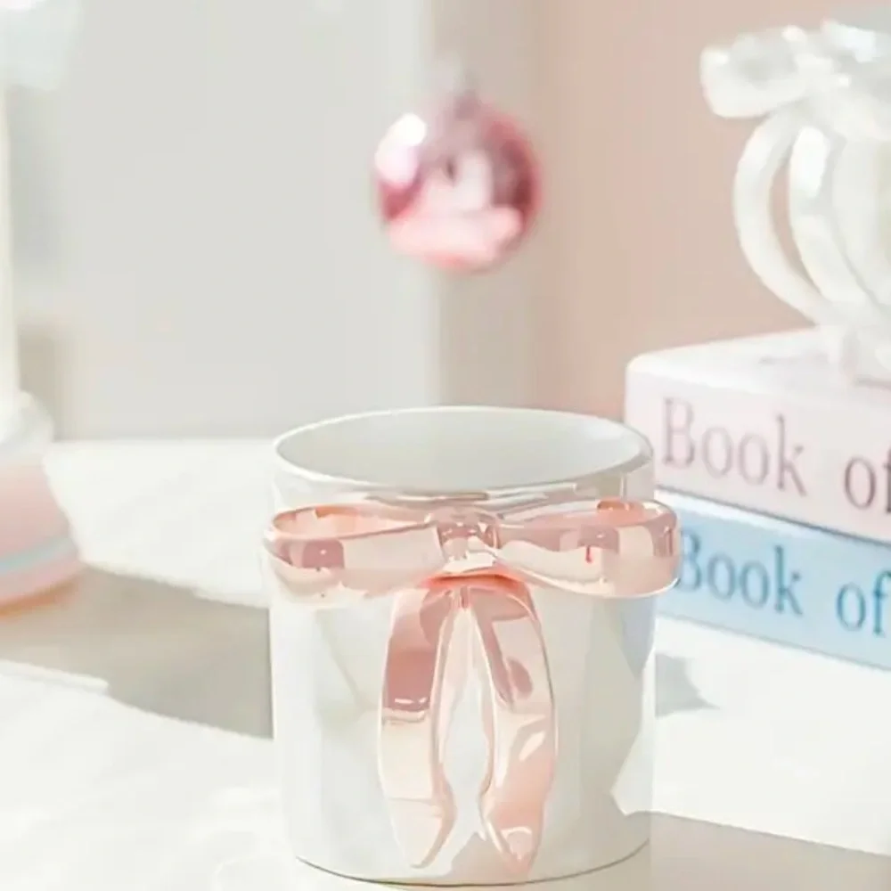 RIBBON HANDLE CUP NEW IN BEAUTIFUL PACKAGE. NIB PINK WHITE AND PURPLE AVAIL